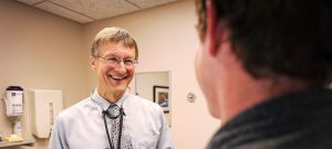 Dr. Gabor Benda talking with a patient at Bozeman Clinic in Bozeman, MT