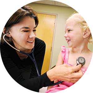 Dr. Christine Mitchell with a pediatric patient at Bozeman Clinic in Bozeman, MT