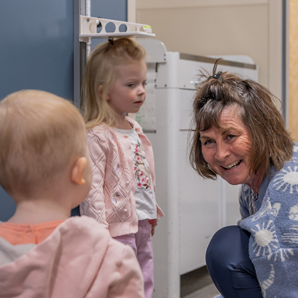 Dr. Christine Mitchell with a family in an exam room at Bozeman Clinic in Bozeman, MT