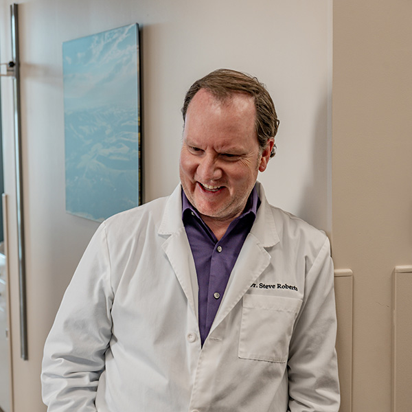 Dr. Gabor Benda with a male patient in an exam room at Bozeman Clinic in Bozeman, MT